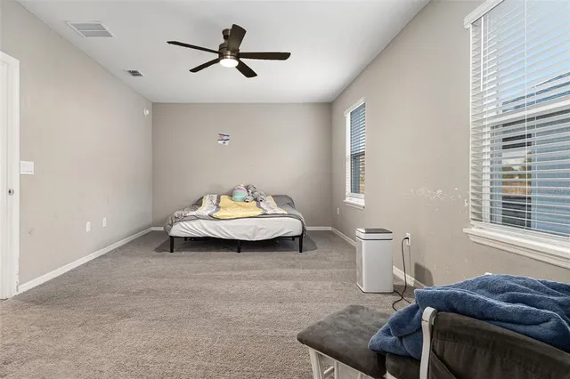 a living room with furniture and window