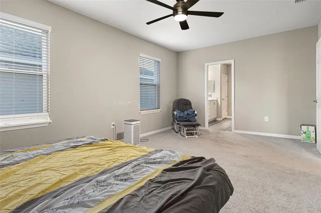 a bedroom with bed and a window