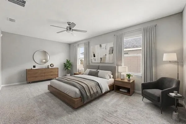 a bedroom with bed couch and window