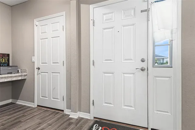 an empty room with wooden floor