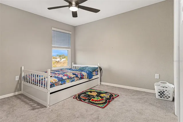 a room with toys and ceiling fan