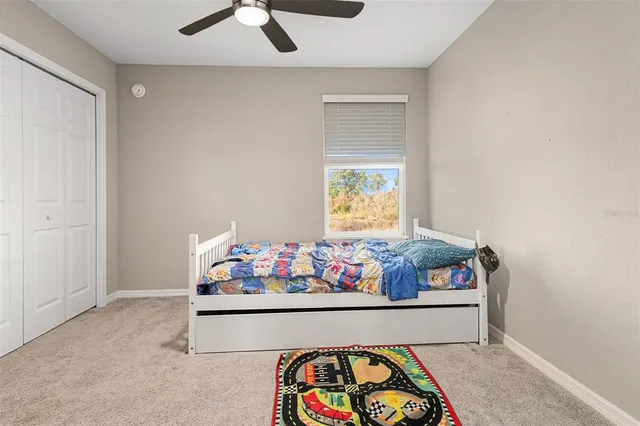 a room with toys and ceiling fan