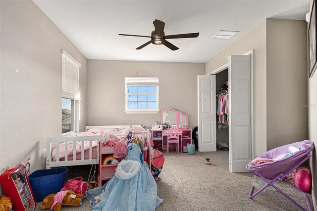 a kids room with bed and a window