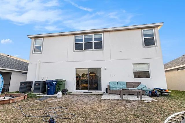 a backyard of a house with seating space