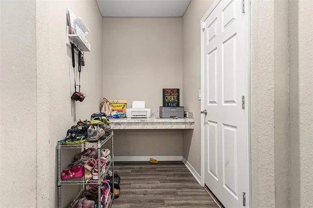 a view of entryway with wooden floor