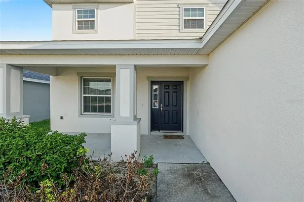 front view of the house with a yard