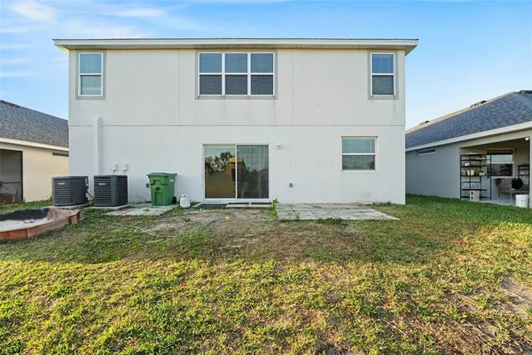 a view of a backyard of the house