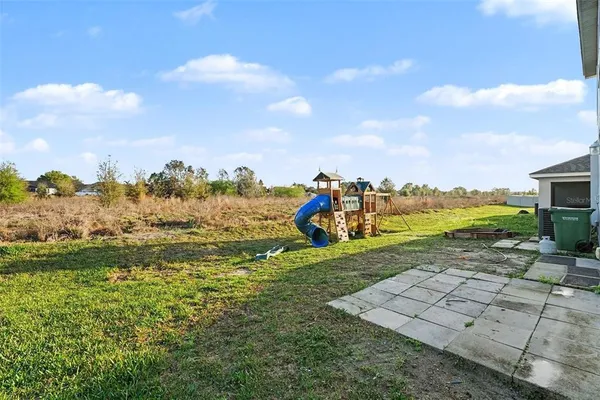 a view of a lake with houses in the back