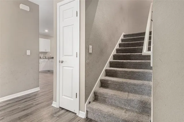 a view of an entryway with wooden floor