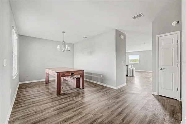 a view of a workspace and wooden floor