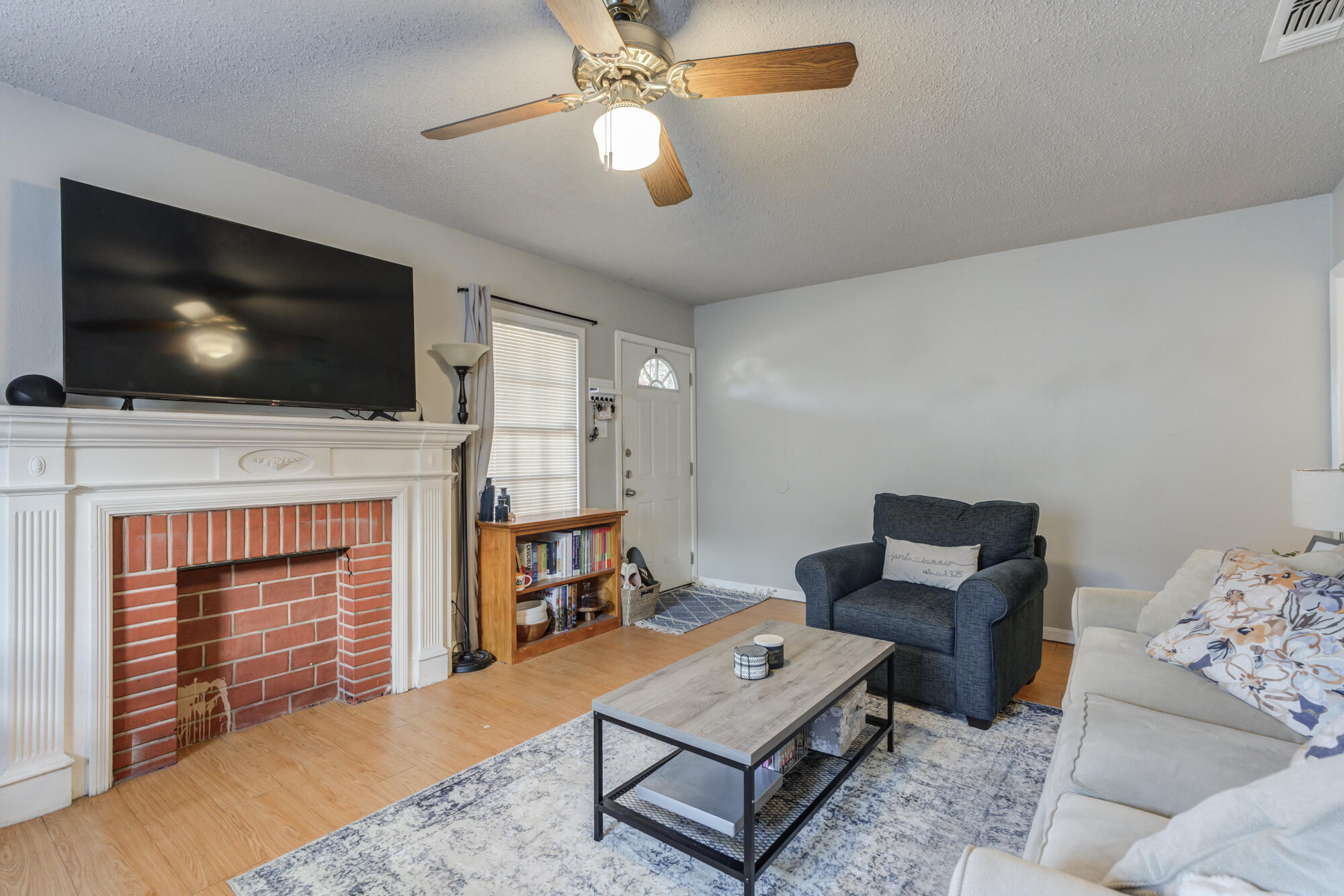 2601 25th Street Lubbock, TX 79410 - Photo 12 of 30 a living room with furniture and a flat screen tv
