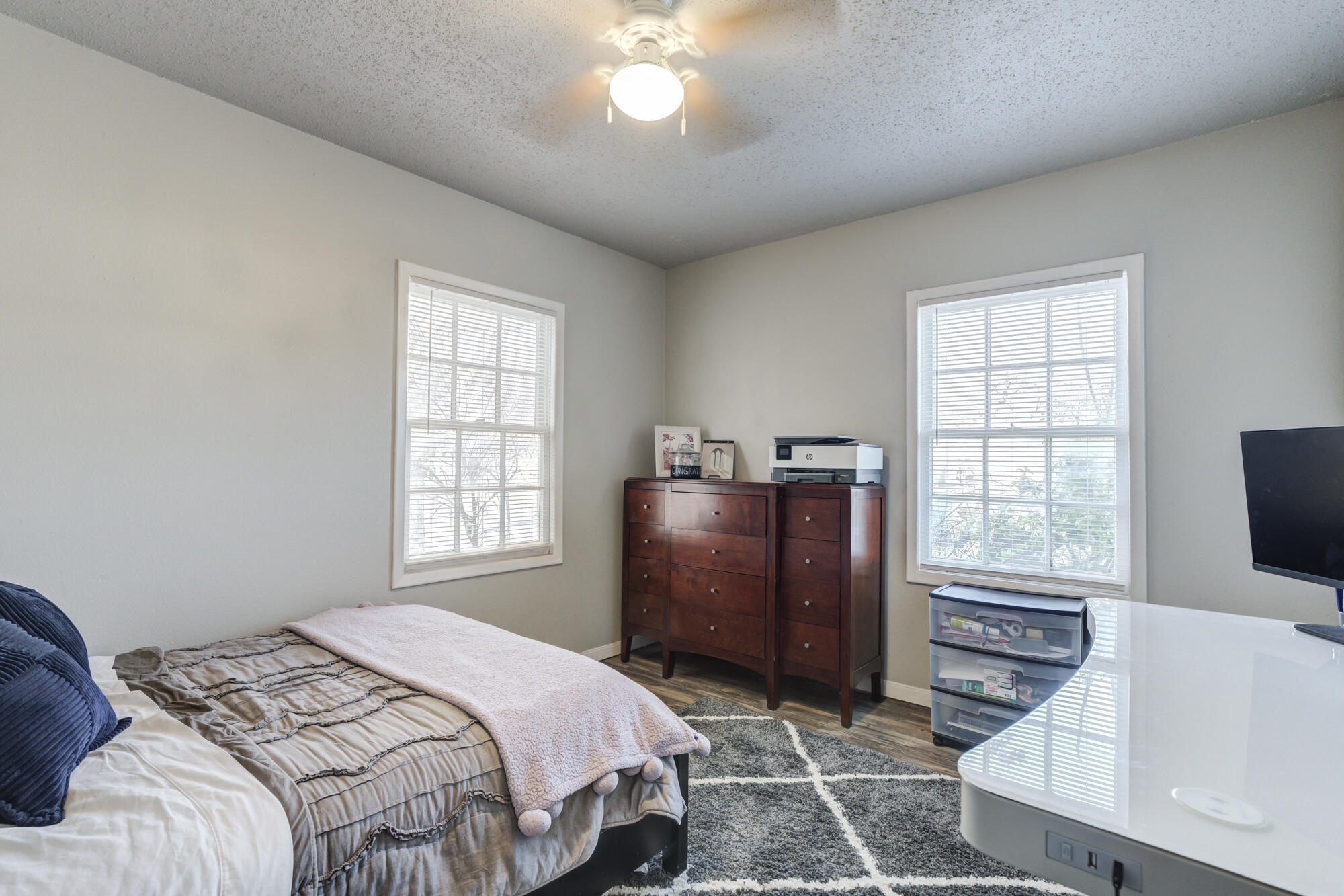 2601 25th Street Lubbock, TX 79410 - Photo 21 of 30 a bedroom with a bed and a window