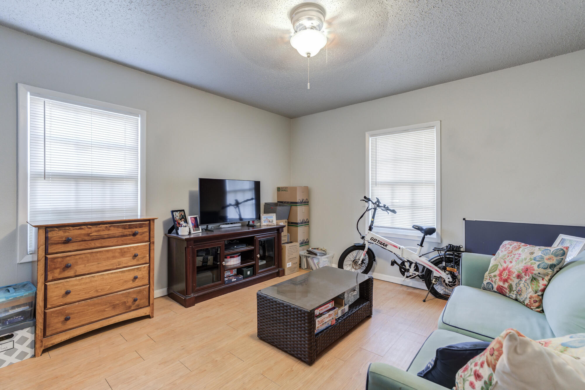 2601 25th Street Lubbock, TX 79410 - Photo 25 of 30 a living room with furniture and a flat screen tv