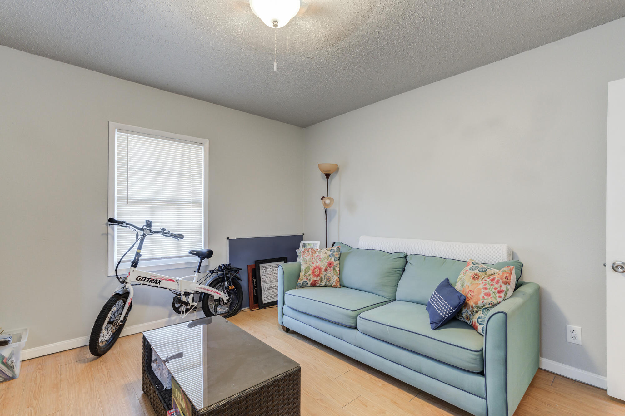 2601 25th Street Lubbock, TX 79410 - Photo 26 of 30 a living room with furniture and a wooden floor