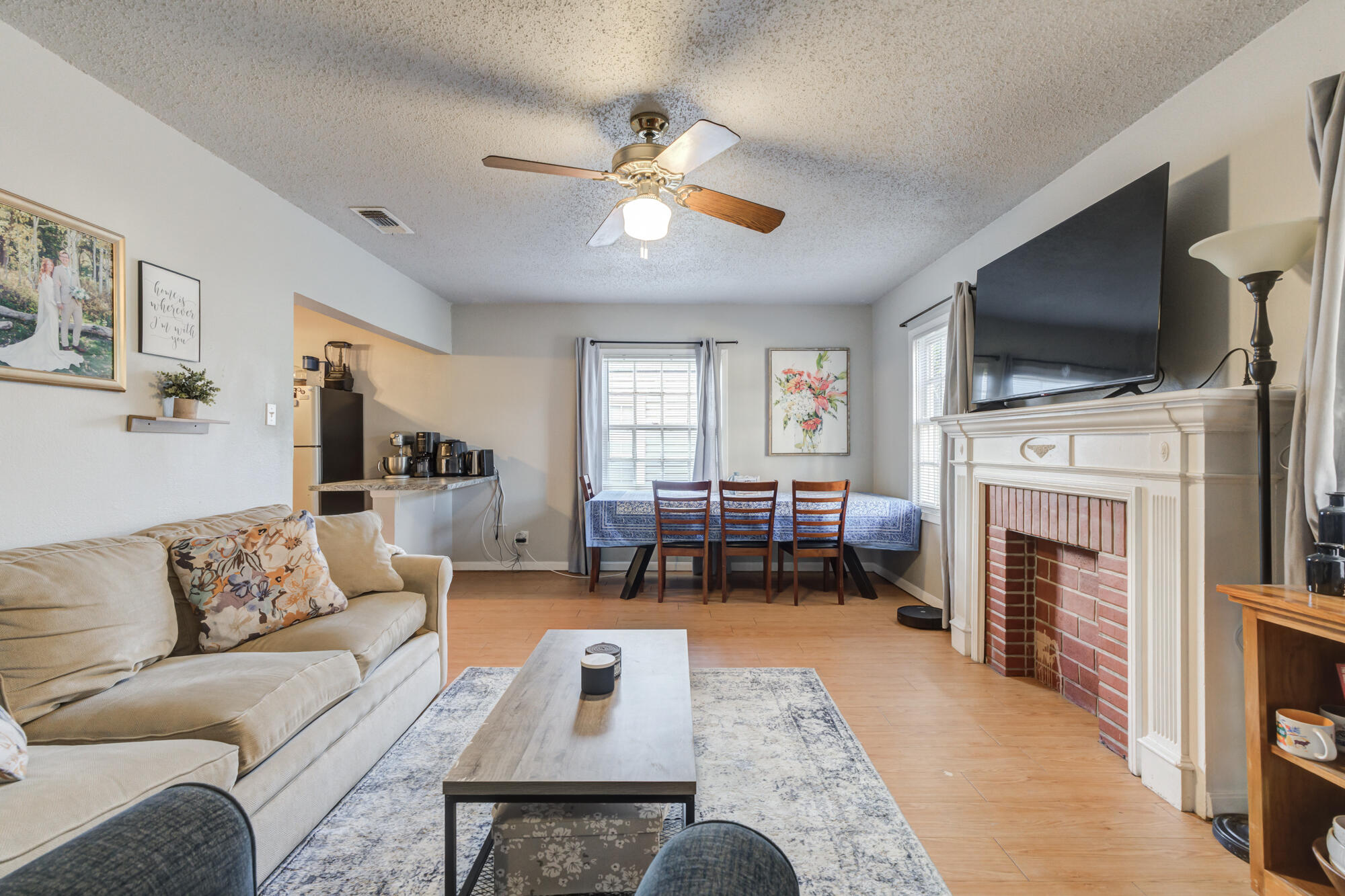 2601 25th Street Lubbock, TX 79410 - Photo 9 of 30 a living room with furniture fireplace and flat screen tv