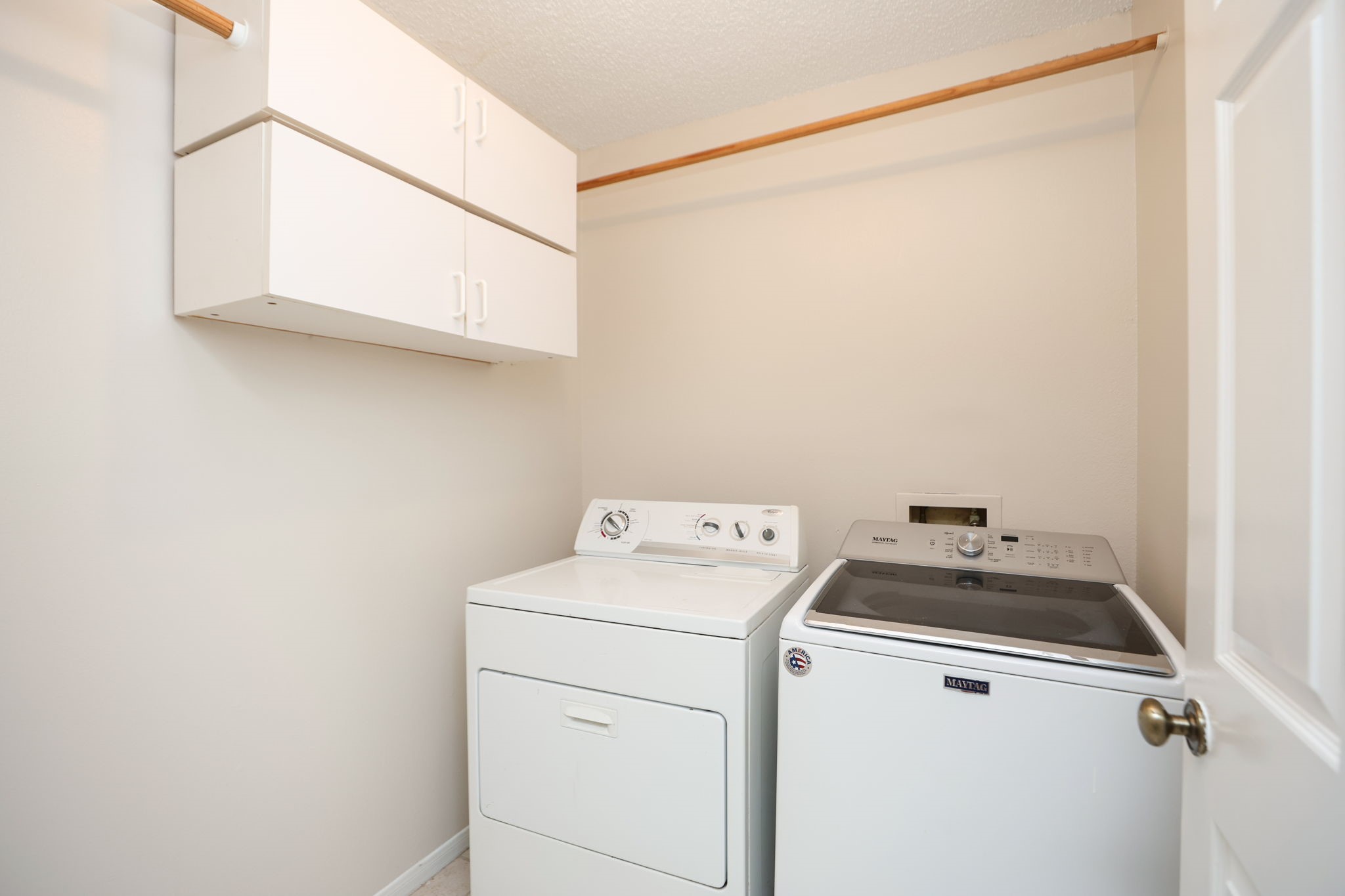 11947 Paddock Way Houston, TX 77065 - Photo 6 of 16 Utility room in the home and has cabinets for supplies.