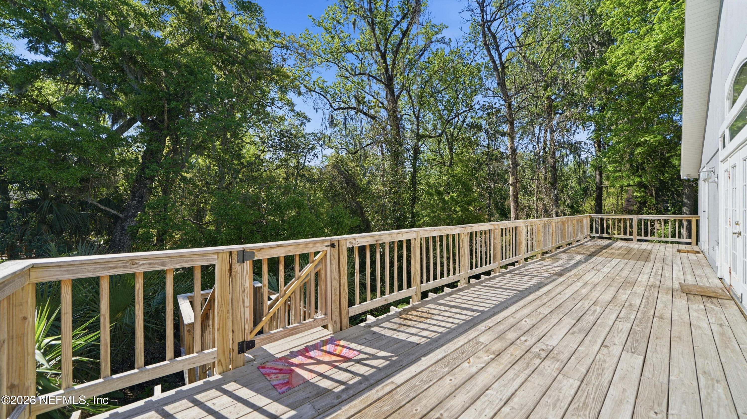2216 Brentfield Road Jacksonville, FL 32225 - Photo 12 of 62 a view of balcony with wooden floor and fence