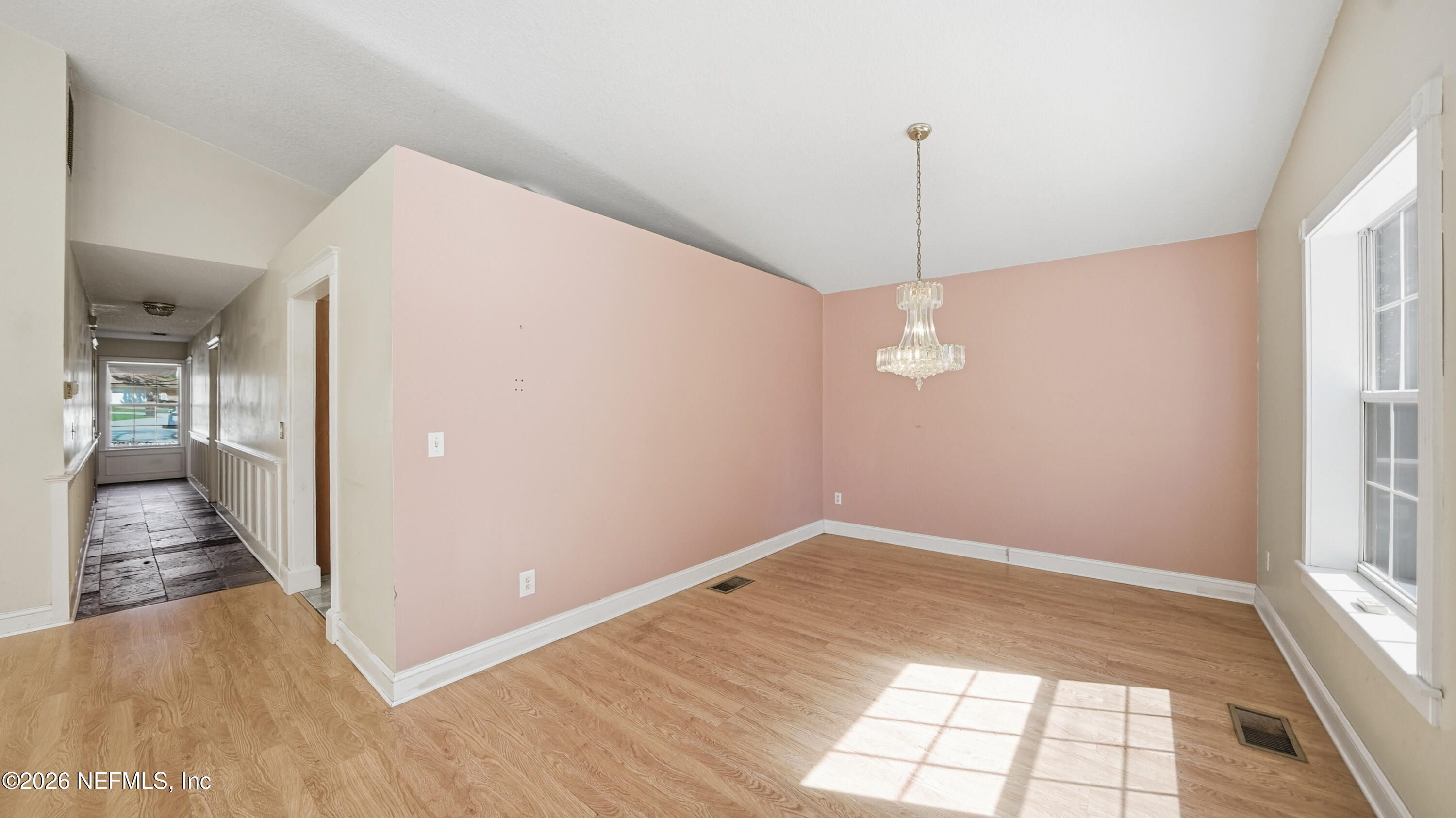 2216 Brentfield Road Jacksonville, FL 32225 - Photo 14 of 62 a view of a room with wooden floor and windows