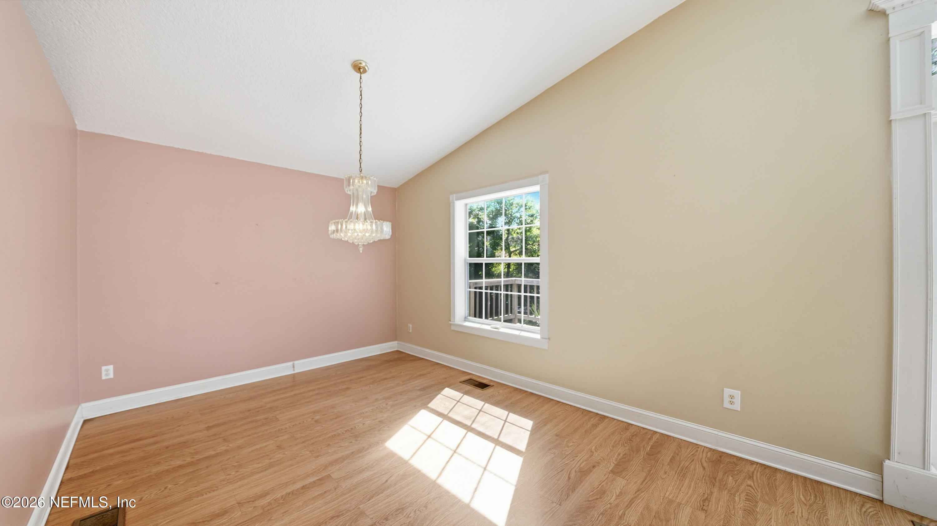 2216 Brentfield Road Jacksonville, FL 32225 - Photo 15 of 62 a view of a room with wooden floor and windows