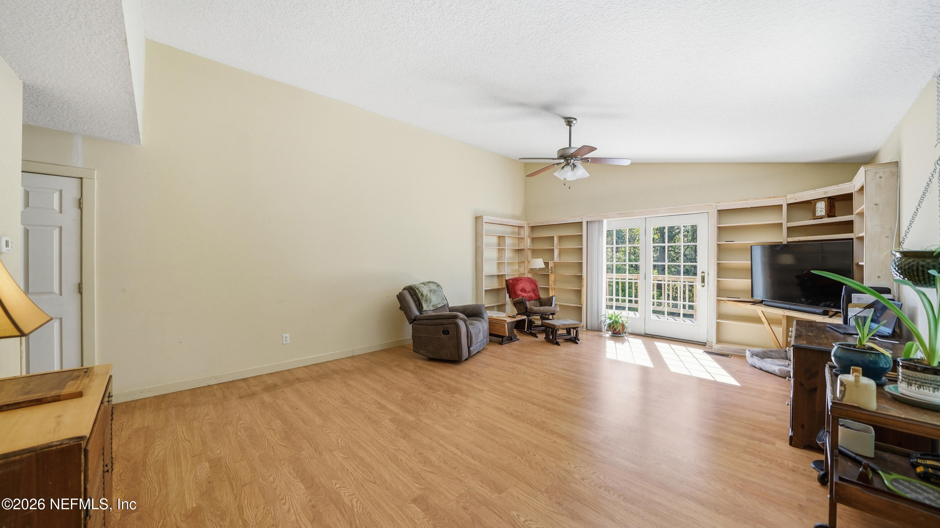 2216 Brentfield Road Jacksonville, FL 32225 - Photo 21 of 62 a view of a livingroom with furniture and a flat screen tv