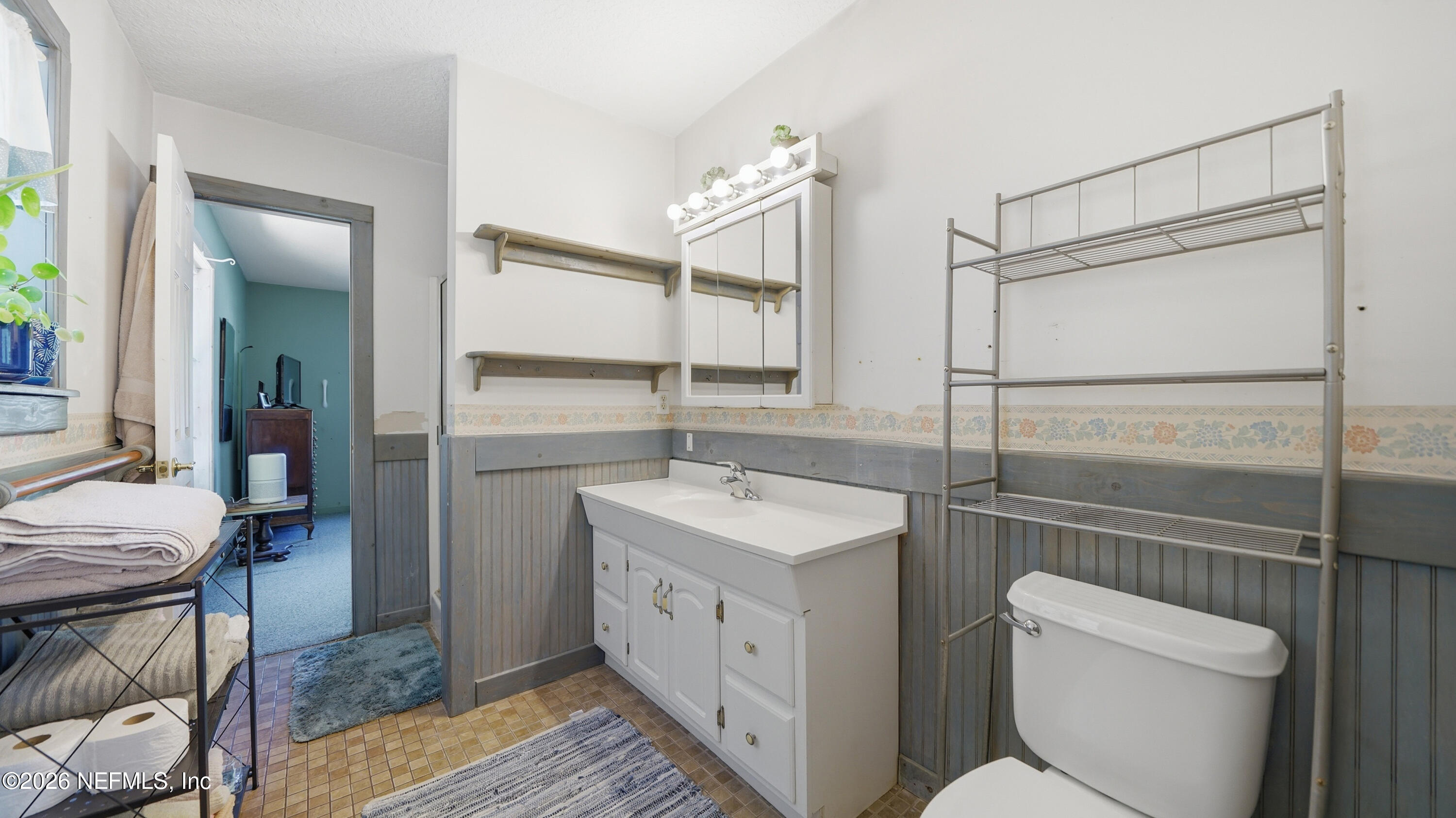 2216 Brentfield Road Jacksonville, FL 32225 - Photo 22 of 62 a bathroom with a sink a toilet and vanity