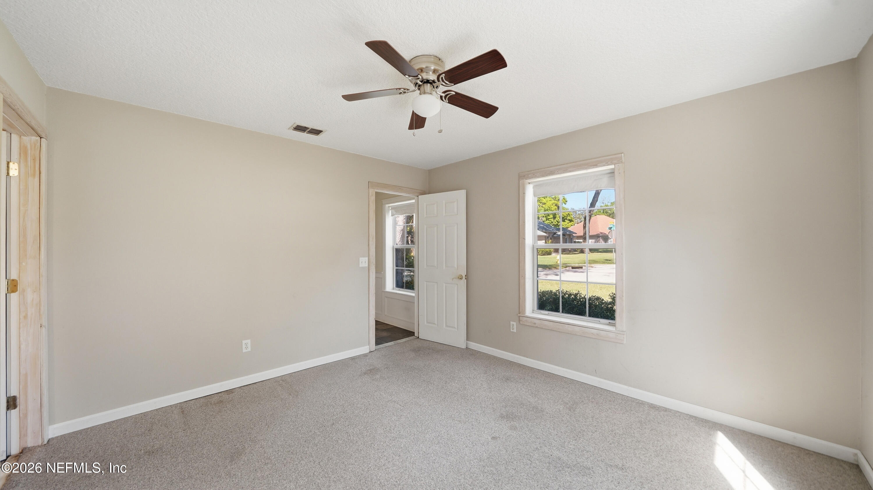 2216 Brentfield Road Jacksonville, FL 32225 - Photo 31 of 62 a view of an empty room with a window