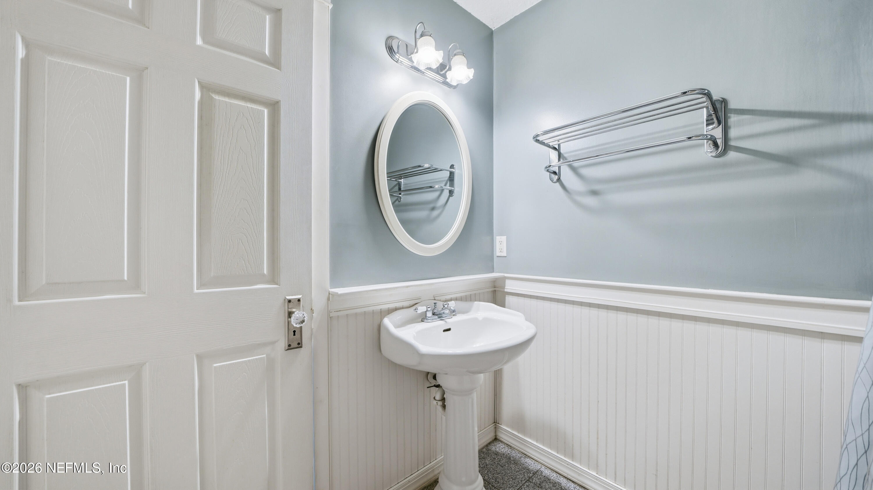 2216 Brentfield Road Jacksonville, FL 32225 - Photo 33 of 62 a bathroom with a sink and a mirror