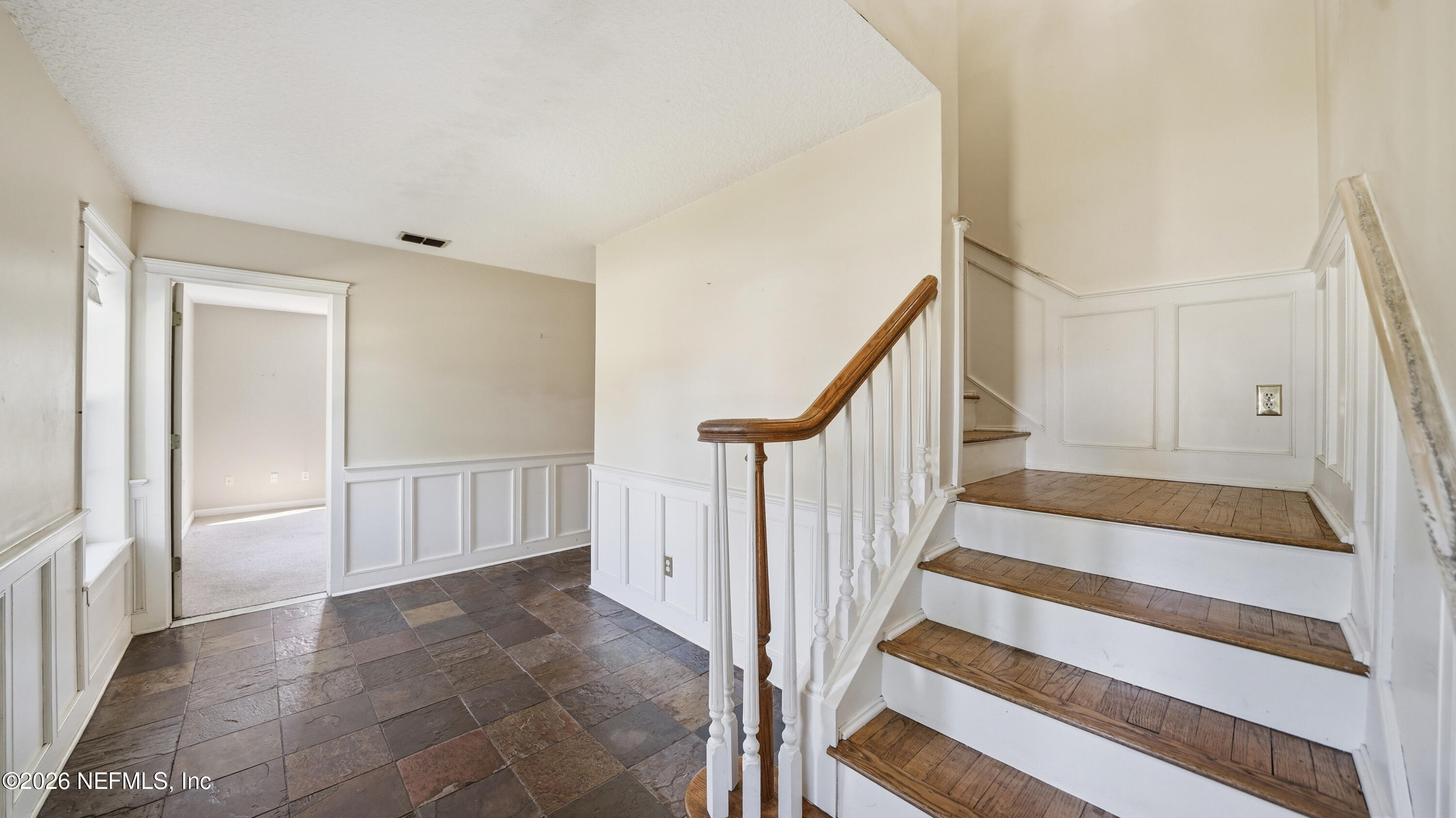 2216 Brentfield Road Jacksonville, FL 32225 - Photo 34 of 62 a view of staircase with white walls and a rug