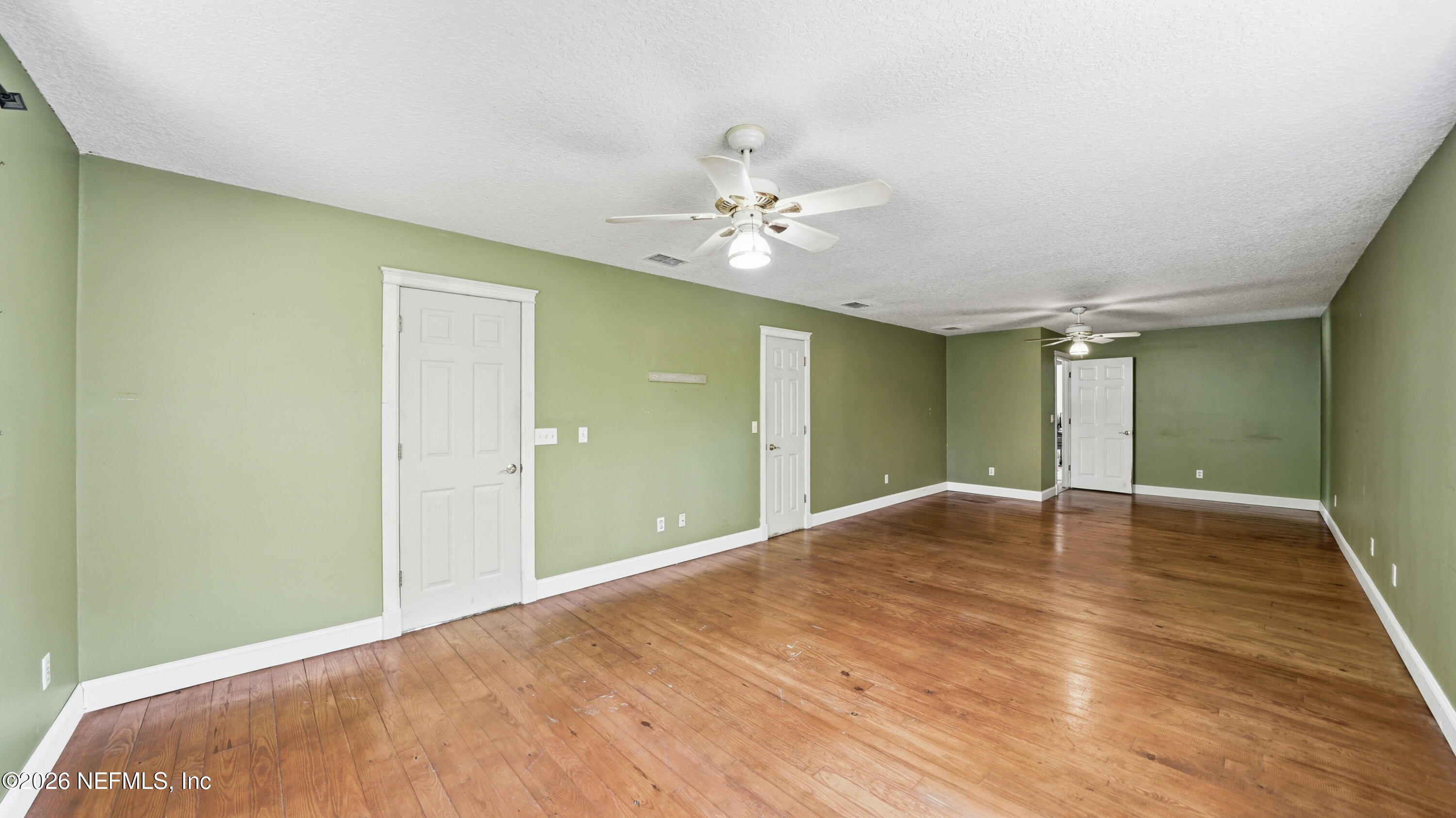 2216 Brentfield Road Jacksonville, FL 32225 - Photo 36 of 62 a view of empty room with wooden floor