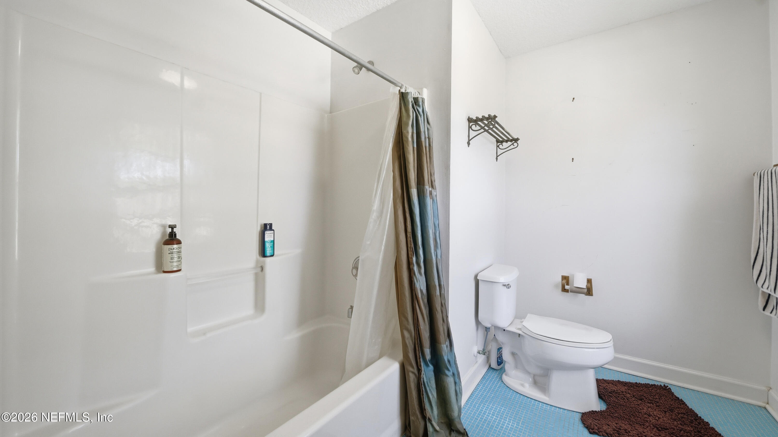 2216 Brentfield Road Jacksonville, FL 32225 - Photo 47 of 62 a bathroom with a toilet and a shower