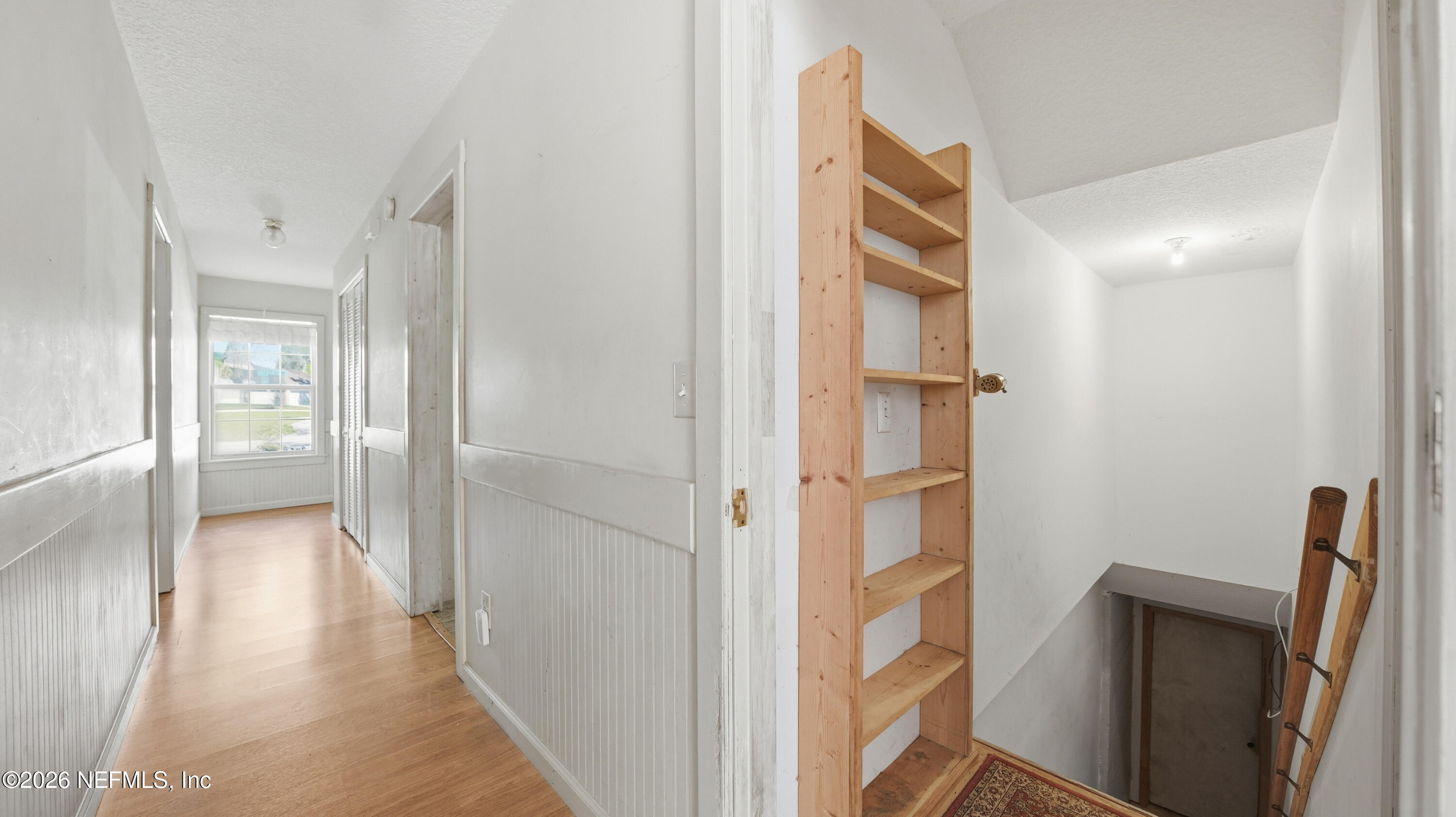 2216 Brentfield Road Jacksonville, FL 32225 - Photo 48 of 62 a view of a hallway with wooden floor and entryway