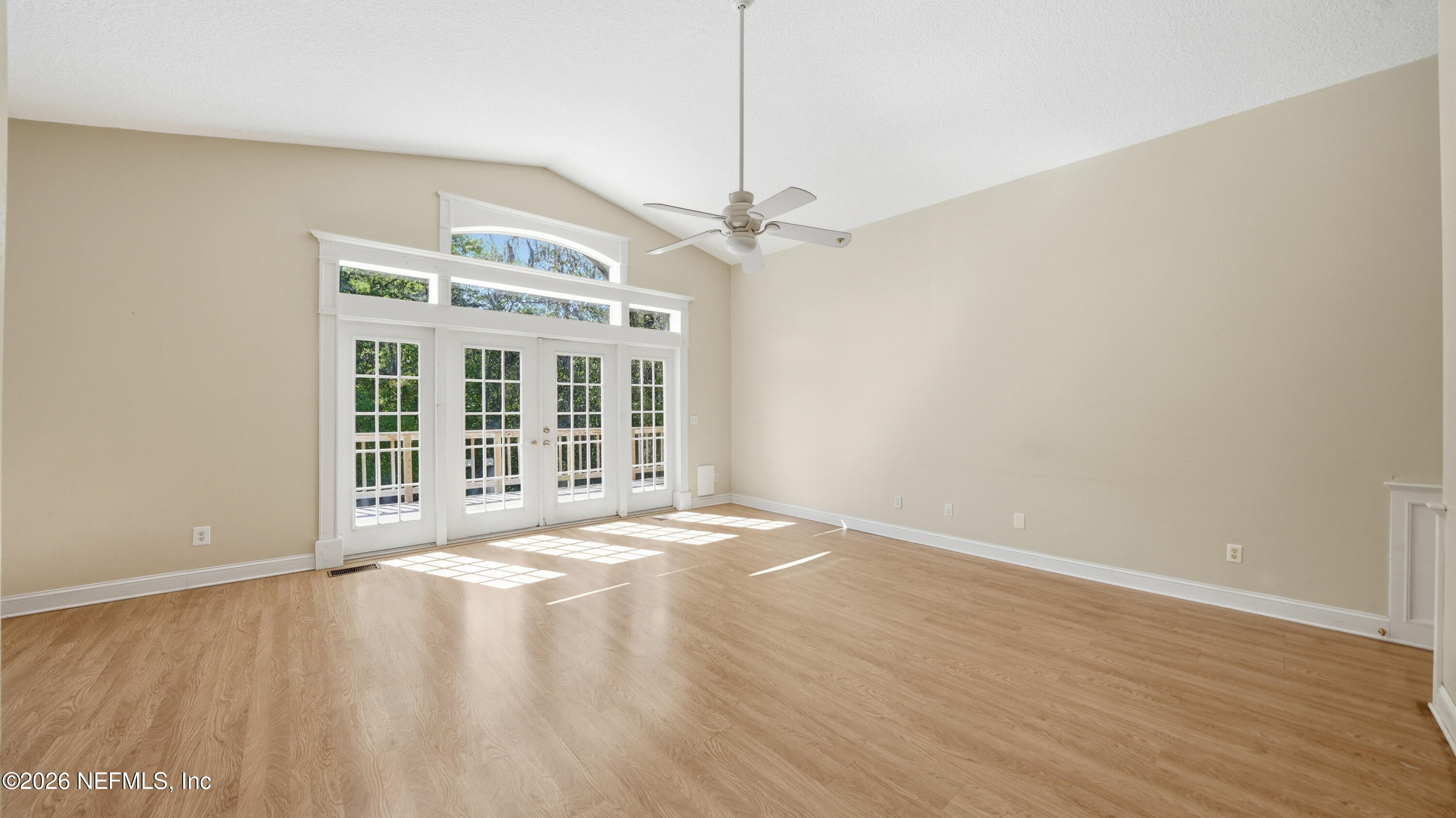 2216 Brentfield Road Jacksonville, FL 32225 - Photo 5 of 62 a view of an empty room with a window and wooden floor