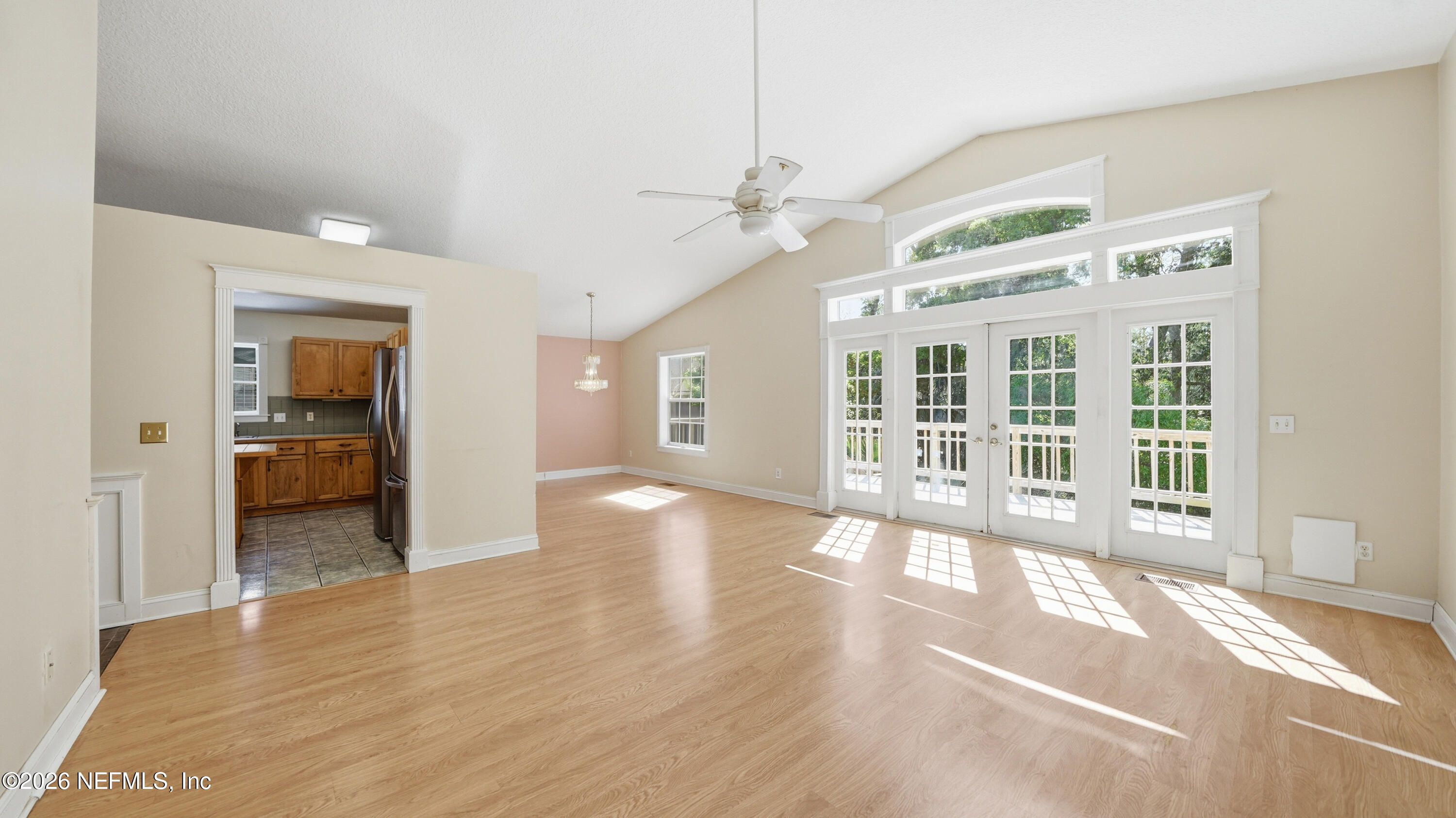 2216 Brentfield Road Jacksonville, FL 32225 - Photo 6 of 62 a view of a big room with wooden floor and windows