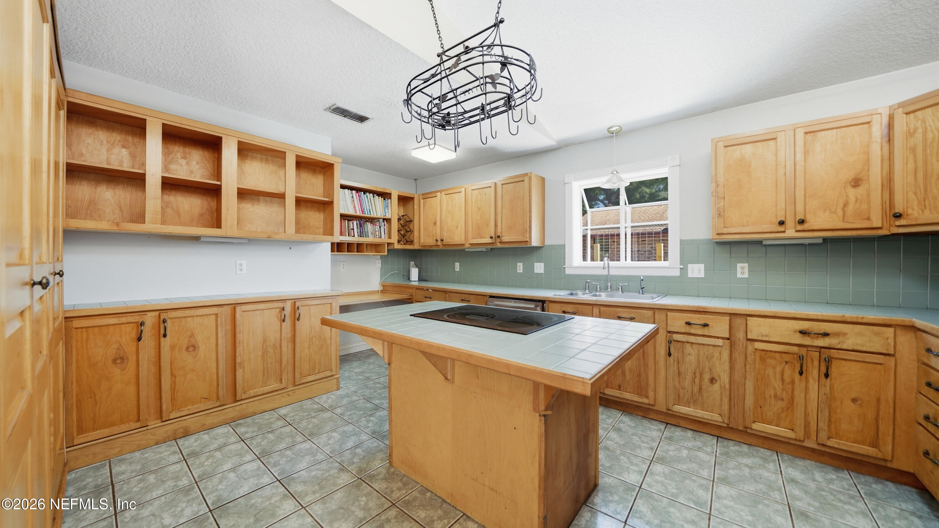2216 Brentfield Road Jacksonville, FL 32225 - Photo 7 of 62 a kitchen with stainless steel appliances granite countertop a stove sink and cabinets
