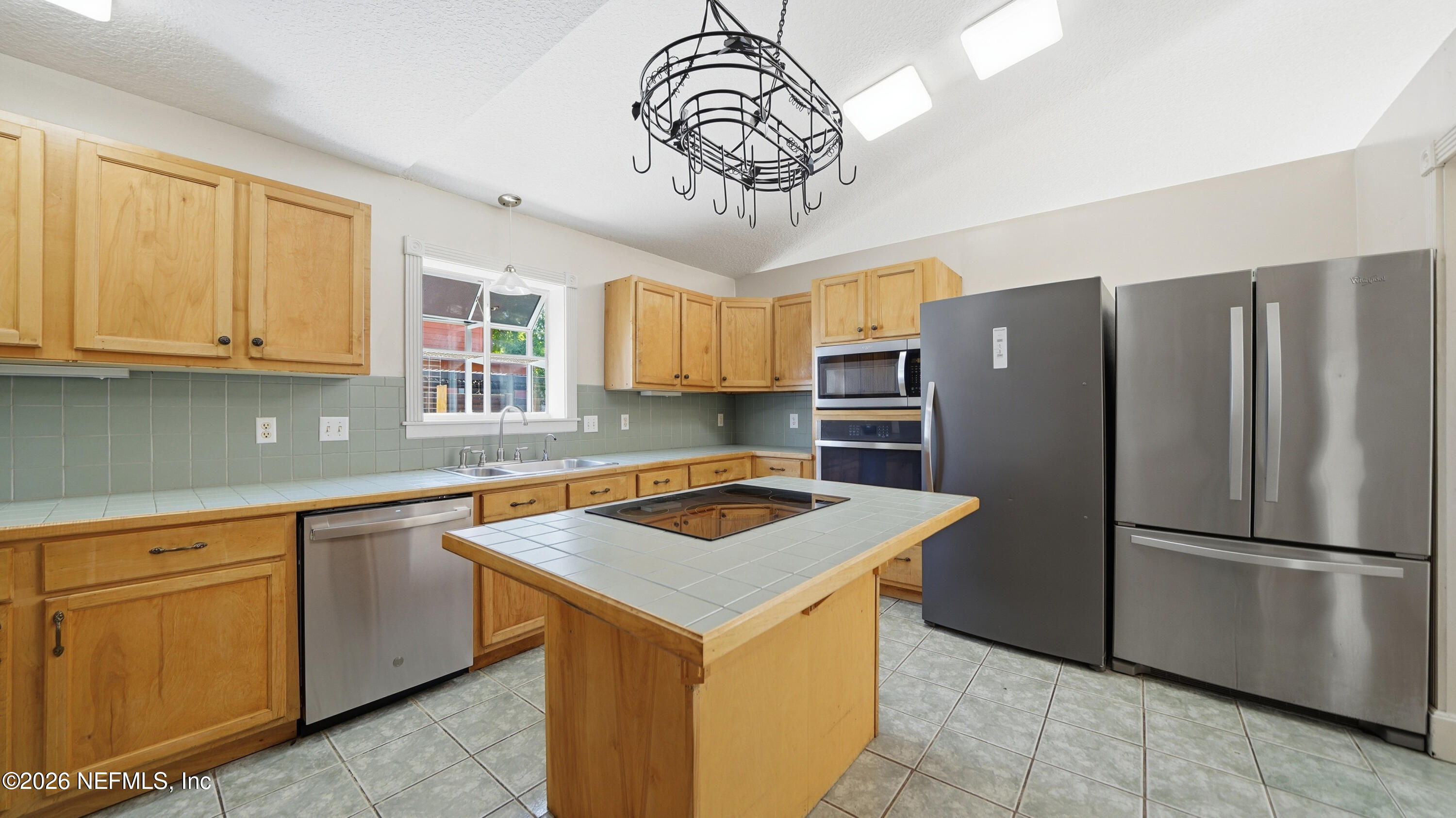 2216 Brentfield Road Jacksonville, FL 32225 - Photo 8 of 62 a kitchen with stainless steel appliances granite countertop a refrigerator a sink dishwasher a stove and white cabinets