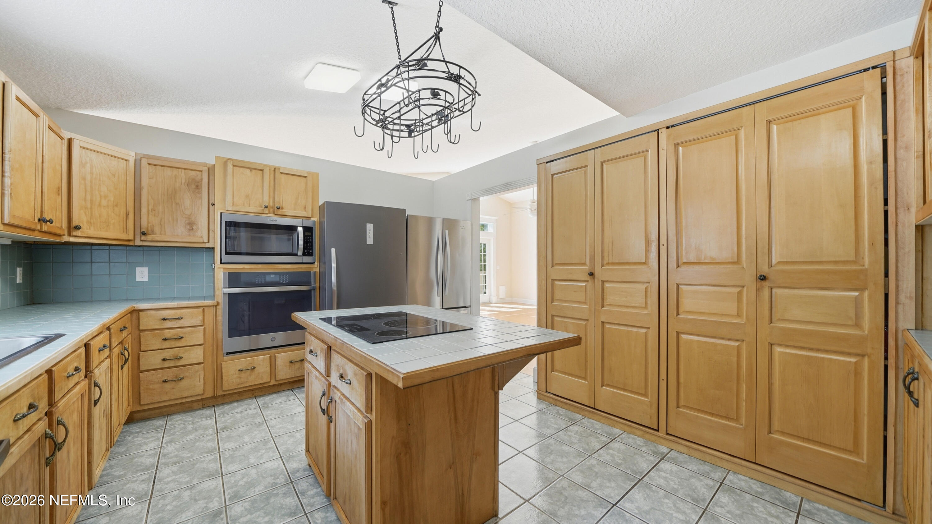 2216 Brentfield Road Jacksonville, FL 32225 - Photo 9 of 62 a kitchen with stainless steel appliances granite countertop a stove a sink dishwasher and a refrigerator