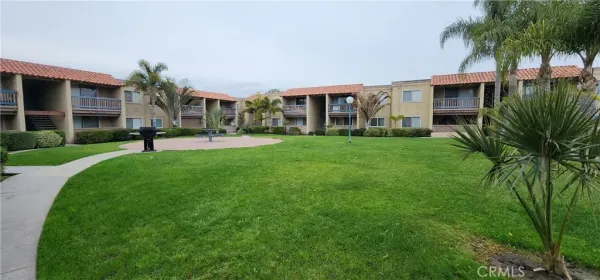 a swimming pool with outdoor seating and yard