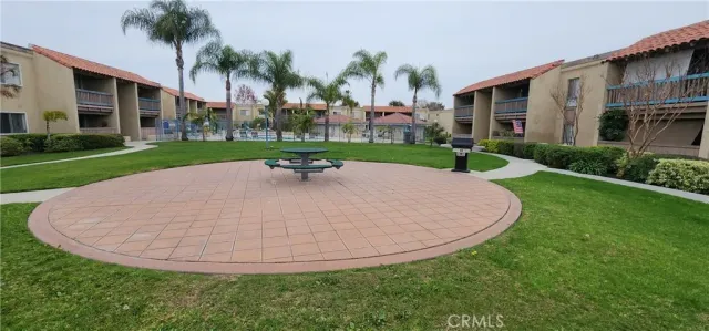 a garden with trees in front of it