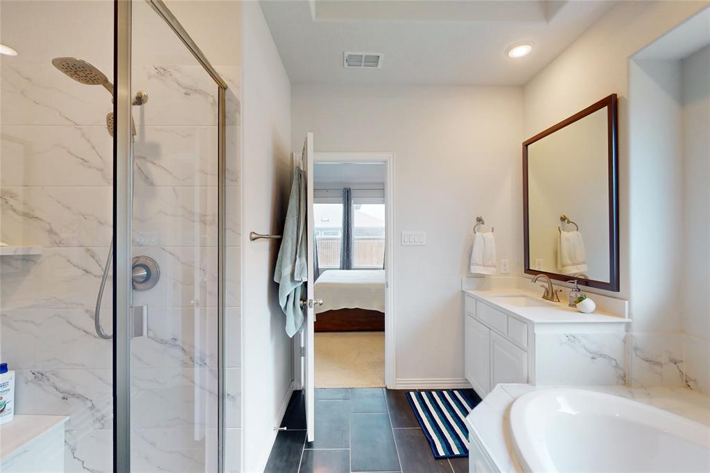 1997 Kieva Place Allen, TX 75013 - Photo 18 of 40 Ensuite bathroom with vanity, a marble finish shower, a garden tub, and recessed lighting