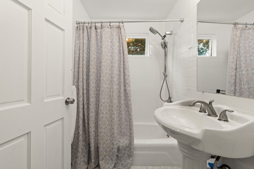 48 Tapped Street Everett, MA 02149 - Photo 18 of 24 a bathroom with a sink and a mirror