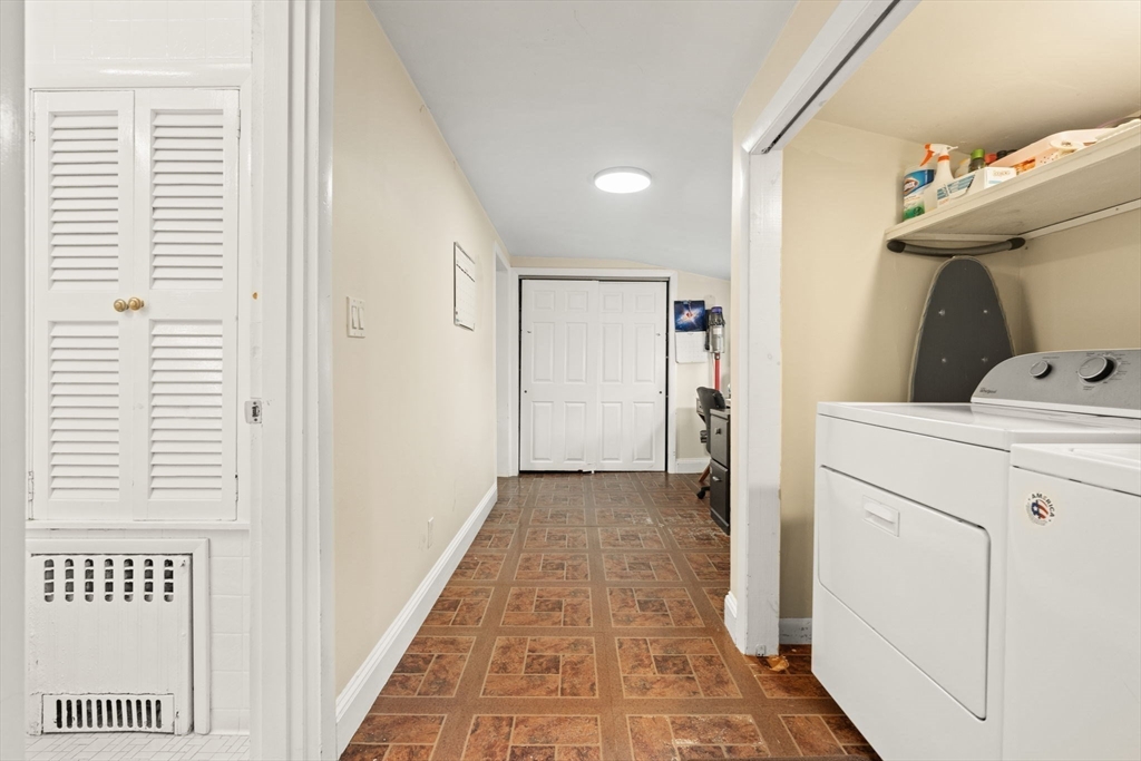 48 Tapped Street Everett, MA 02149 - Photo 19 of 24 a view of a hallway to closet and utility room