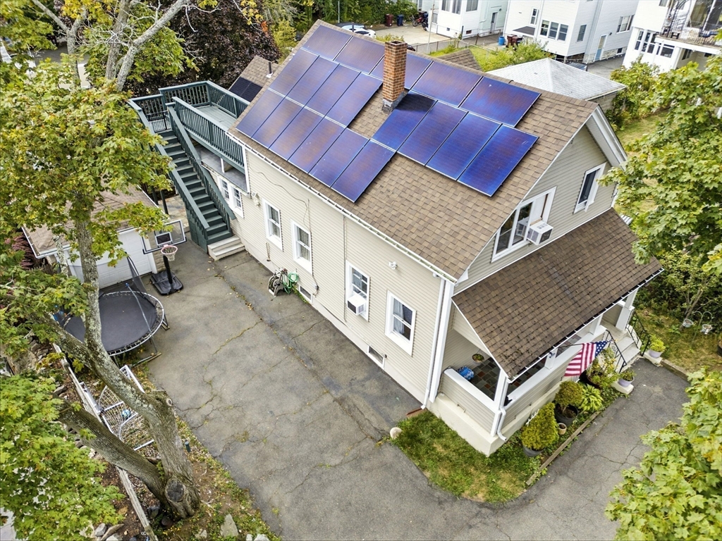 48 Tapped Street Everett, MA 02149 - Photo 23 of 24 an aerial view of a house with a yard basket ball court and outdoor seating