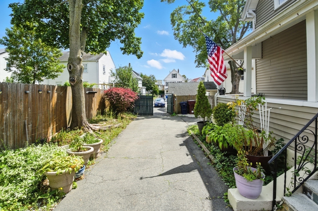 48 Tapped Street Everett, MA 02149 - Photo 3 of 24 a sign that is sitting in front of a house