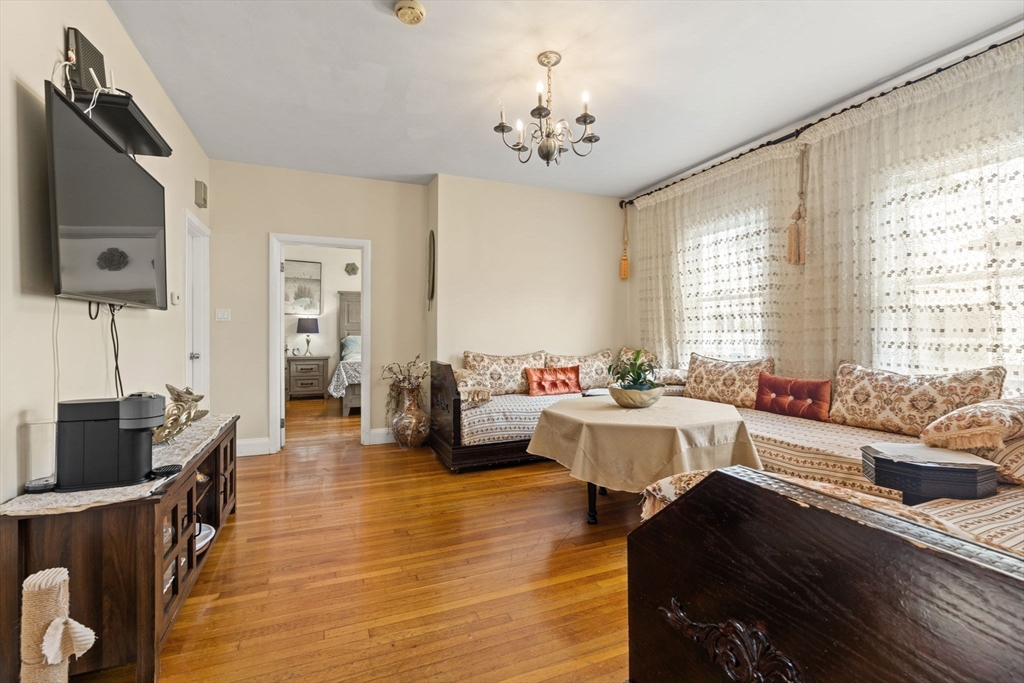 48 Tapped Street Everett, MA 02149 - Photo 6 of 24 a living room with furniture and a flat screen tv