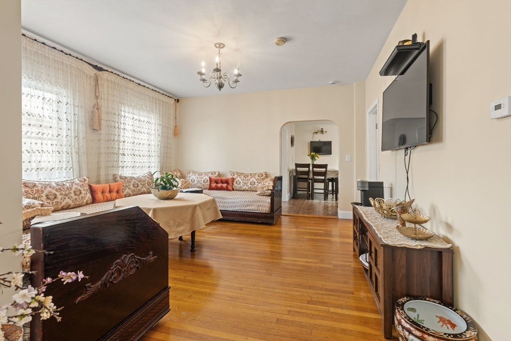 48 Tapped Street Everett, MA 02149 - Photo 7 of 24 a living room with furniture and a flat screen tv
