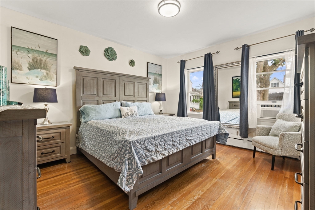 48 Tapped Street Everett, MA 02149 - Photo 8 of 24 a bedroom with a large bed and a window