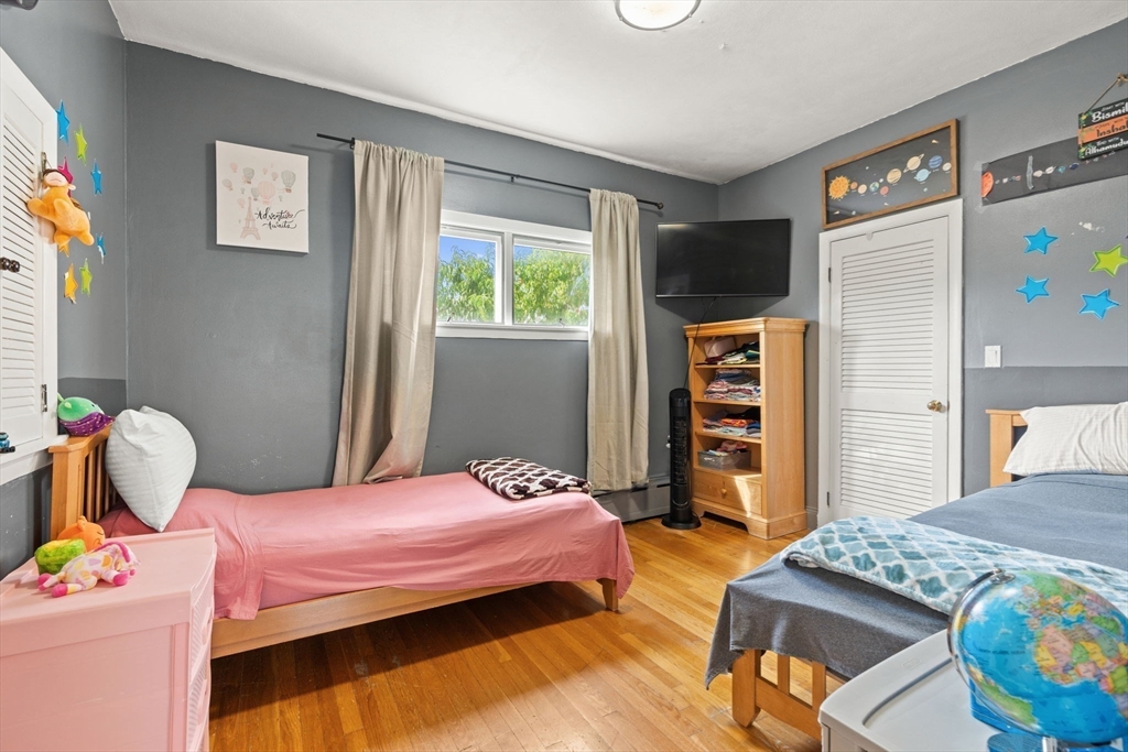 48 Tapped Street Everett, MA 02149 - Photo 10 of 24 a bedroom with bed and window