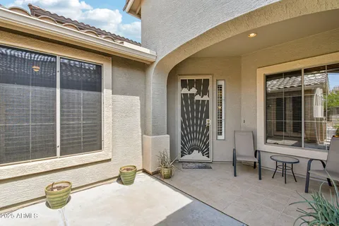 a backyard with table and chairs