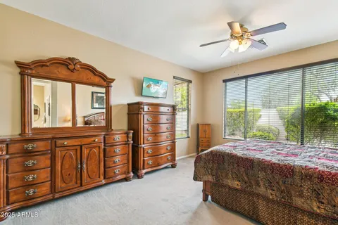 a bedroom with a bed and a large dresser