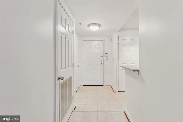 a bathroom with a shower and a glass door